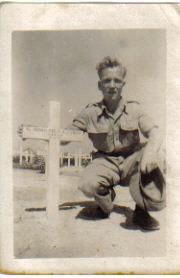 Bill Smith next to his brother John's grave in Egypt 1942